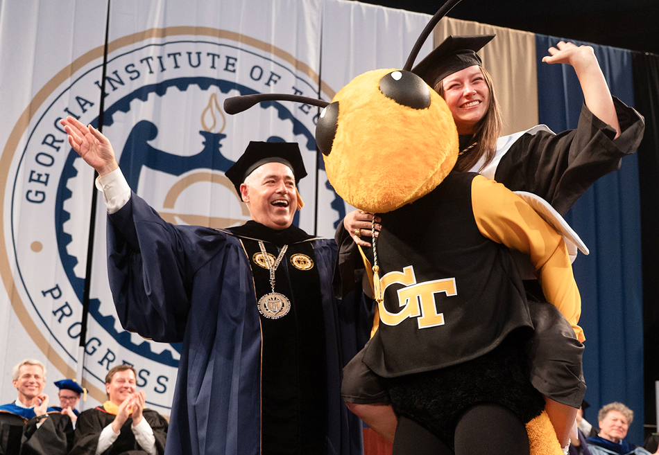 Grad waving and riding Buzz with President Cabrera